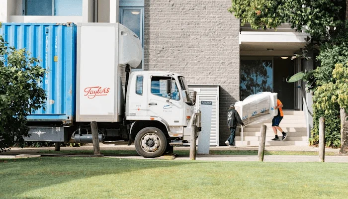 Professional removalists loading a truck